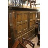An early 19th Century two piece oak kitchen cabinet.