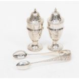 A pair of pepperettes Chester, 1912, 1.58 ozt approx, together with a pair of sugar tongs, .54 ozt