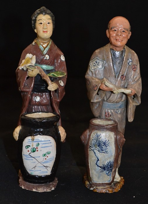 A pair of early 20th Century Japanese figures, man and woman