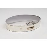 A Georg Jensen oval compact, the cover with raised stylised bud finial, fitted interior, the
