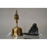 Small bronzed figure of a monk with carp and turtle, unsigned, plus a Tibetan brass bell (2)