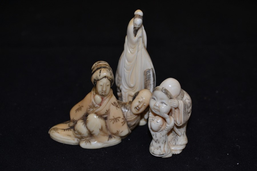 Three ivory Netsuke figures including an old man with mask, male figure on horseback and a male