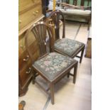 A set of Four 19th Century mahogany dining chairs with tapestry covered seats