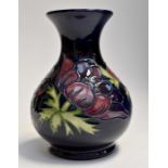 A boxed Moorcroft anemone vase