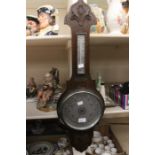 A circa 1930's banjo style oak aneroid barometer (A.F)