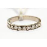 An 18ct white gold diamond half hoop eternity ring, total diamond weight approx 0.60ct, size Q,