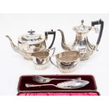 A collection of silver and silver-plate including a George V matched three piece service, Georgian