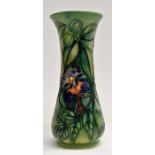 A Moorcroft tapering rain forest vase decorated with beaded iris, approx 20.5 cms high