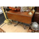 A Late 19th Century mahogany Pembroke style dining table with drawer to one side and two drop