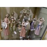 Collection of 11 Lladro figures of girls with hats, some with encrusted flowers.  Condition: