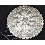 A Turkish 20th Century circular highly decorative mirror, 30 cms diameter approx