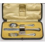 A silver christening set including fork, spoon, knife and napkin ring, by Brook & Son of