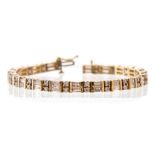 A diamond 14ct yellow gold line bracelet, comprising two rows of alternating round and baguette