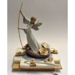 A Lladro "Momento Mori" composition of an Angel punting a coracle surrounded by flowers.