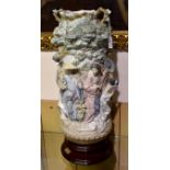 Very large Lladro vase on wood base decorated with Japanese Geisha girls and encrusted with flowers.