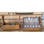 An Edwardian tantalus, with three cut glass decanters, with added tray for twelve dram glasses (