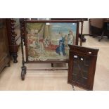 An early 20th Century mahogany framed tapestry firescreen; a mahogany small corner cupboard (2)