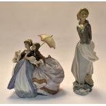 Lladro: A study of two young ladies "Fortune Telling" in historical costumes and a single figurine