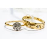 A gold buckle ring, set with two diamonds, stamped 18ct, size Q, approx 2.7gms; together with an