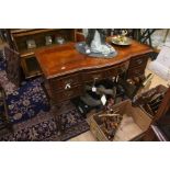 A Reproduction 20th Century Georgian sideboard, mahogany three drawer over two