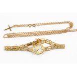 A 9ct ladies Geneve wristwatch, approx 9.1gms; with a 9ct gold crucifix on 9ct chain, approx 3.