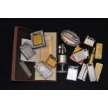 A collection of pocket lighter and table lighters including gold plated large cased Dupont desk