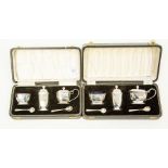 A pair of Birmingham silver cruet sets and mustard pots (both cased)