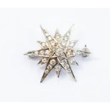 An 18ct white gold and diamond star brooch, C&F London 1987, total gross weight 4.5gms