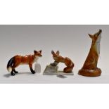 Two Hungarian Herend porcelain foxes with another