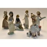 A group of six Lladro and Nao young girl studies, three with doves no's 6157, 7611, 6153, 5466