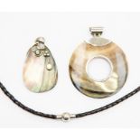 Silver and cut shell jewellery; two pendants, together with a leather neck item with silver clasp (