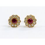 A pair of 9ct yellow gold, red spinel and diamond cluster stud earrings, stamped 375, total gross