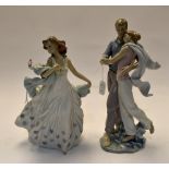 Two Lladro figures "Lovers" and "In Party Dress" with bird, no's 6193 and 6842