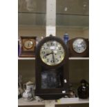 A 1930's oak wall clock along with two early 20th Century mantle clocks