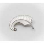 Albert Scharning - a silver and enamel brooch in the form of a feather, white guilloche enamel,