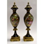 Modern reproduction Spanish pair of urns and covers in gilt metal mounts, hand painted decoration-