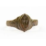 A bronze ring with cross in the centre