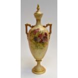 A Royal Worcester blush ivory tywin handled vase and cover, painted florals. 247H