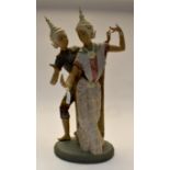 A large Lladro male and female "Thai" dancing pair, matt glaze