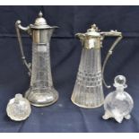 A collection of claret jugs and perfume bottles