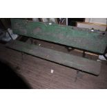 An early 20th century oak and iron framed garden table bench