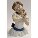 A Lladro study (half body) of a young girl in pose with a flower, E19E
