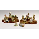 Twelve Beswick Beatrix Potter figures, with two Woodland Stands