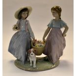 Lladro: two young girls carrying a basket of flowers with puppy, no 6250