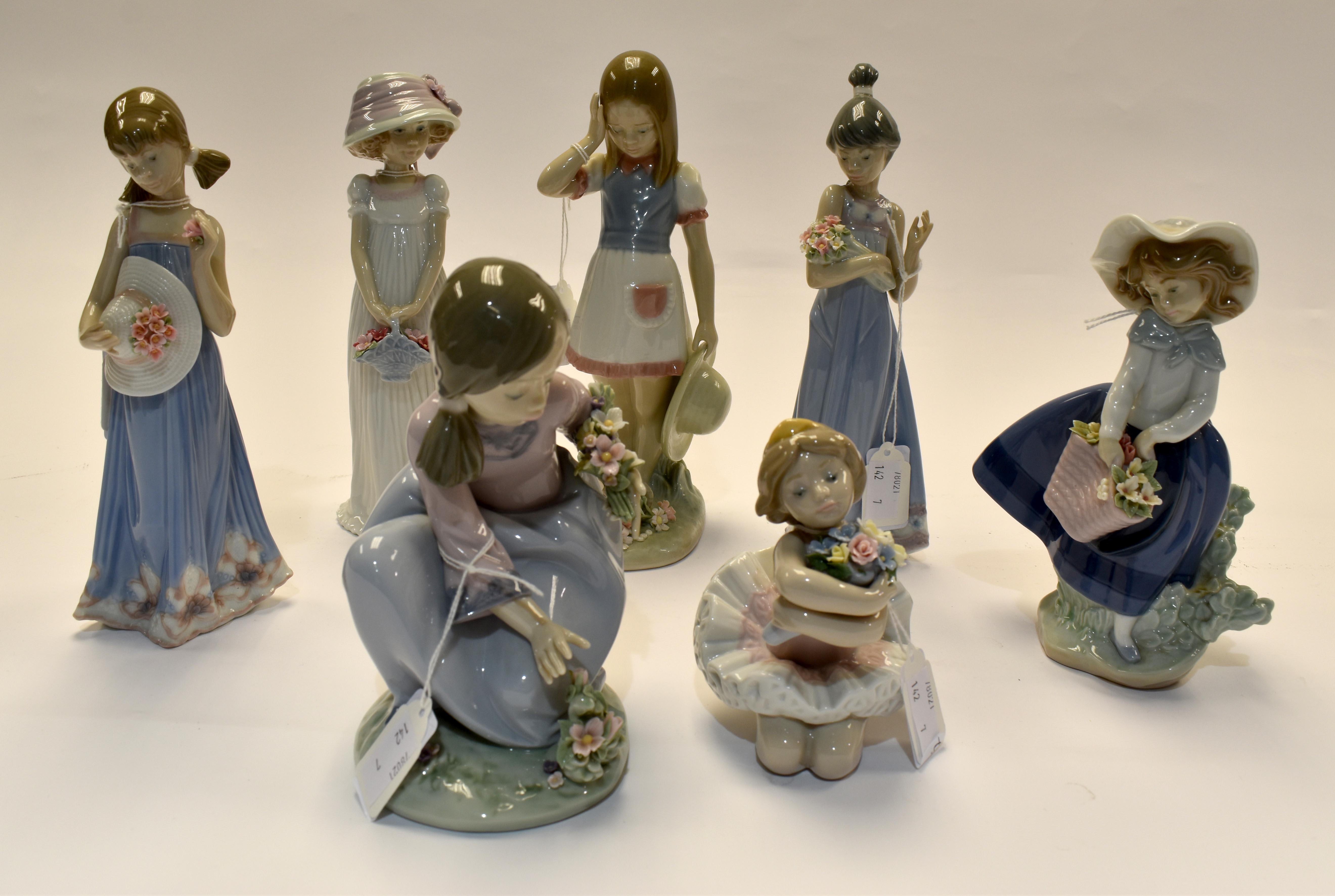 7 Lladro figures of girls with encrusted flower decoraTION. Condition: Girl with flowers in arm- one