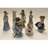 7 Lladro figures of girls with encrusted flower decoraTION. Condition: Girl with flowers in arm- one