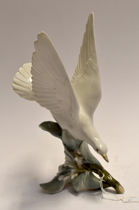 A Lladro study of a Seagull resting on a berried branch- with paperwork