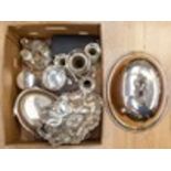 A collection of silver plate including an epergne food cover, condiment set, boxed salt and pepper