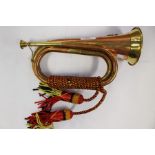 A reproduction Copper and Brass Military style Bugle. No makers marks. 295mm in height. Complete