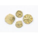 Four medieval lead tokens